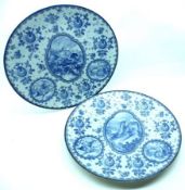 A pair of Bonn blue printed circular Wall Plates, decorated with vignettes of scenes, includes a