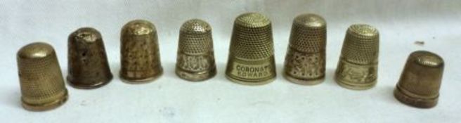 A collection of five hallmarked Silver Thimbles (conditions vary); a Sterling example and two