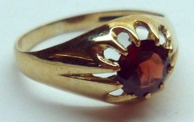 A hallmarked 9ct Gold single stone Garnet Signet Ring, claw setting