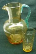 A pair of Amber Glass Lemonade Jugs with blue glass handles (one A/F) and five matching Glasses, the