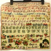 A mid 19th Century Sampler in brightly coloured Silks, Alphabetical and Numerical central design, of