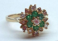 A hallmarked Gold six small Emerald and twelve small brilliant cut Diamond Ring (marks incomplete)