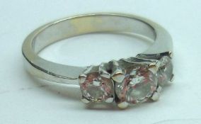 A high grade precious metal three stone Brilliant Cut Diamond Ring, approximately.7 ct total,