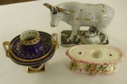 A large Staffordshire style Group of Cow and Milkmaid, (much of decoration worn); a further European