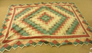 A Patchwork Quilt mostly in green and red design, with zigzag hem, 94” x 70”