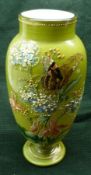 A late 19th/early 20th Century French Opaque Glass Vase painted with butterfly amongst floral sprays