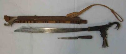 Dyak Headhunters Sword Mandau, swollen single-edged blade 20”, carved wooden hilt with jaws inset