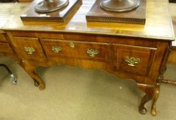 An 18th Century and later Walnut Three Drawer Low Boy, with one long and two short drawers, raised