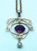 An Edwardian 9ct Gold Scrollwork Open Pendant with articulated Amethyst centre and Pearl drop,