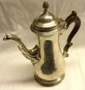 A George III period Coffee Pot of circular baluster form, to a circular foot, acanthus clad spout,