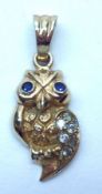 A hallmarked “9ct” Gold Owl Pendant, gemstone set, 22mm drop, weighing approximately 2 ½g all in