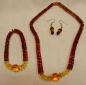 A Graduated Amber Disc Necklace, Bracelet and Earrings Set, approximately 33 gm