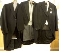 Three Vintage Gentleman’s Suits to include: A black Wool Tail Coat, a black/grey Chalk striped