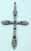 A precious metal Filigree Cross in Celtic style, set with small Diamonds and Sapphires, 48mm drop