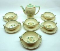 Six Susie Cooper floral decorated double-handled Soup Bowls and Saucers, 6 ½” diameter on saucers