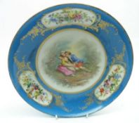 A late 19th/early 20th Century Continental Painted Dish, the centred decorated with a panel of two