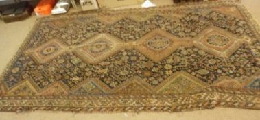 A Caucasian Runner with multi gull border, central panel of lozenges, mainly black, beige, brown and