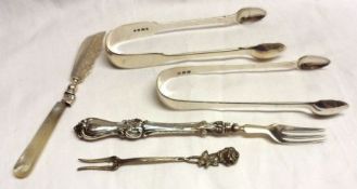 A Mixed Lot comprising: A pair of Victorian fiddle pattern Sugar Tongs, London 1842, a pair of