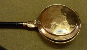 A 19th Century Copper Bed Warming Pan of typical form, the lid with chased floral design to a
