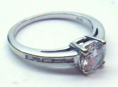 A hallmarked 18ct White Gold Solitaire Diamond Ring of approximately ¾ ct, having five small