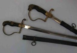 Third Reich Cavalry Officer’s Sword, curved blade 35 ½”, wire-bound celluloid grip, chiselled lion’s