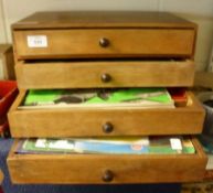 A Mahogany Four Drawer Case containing a large quantity of Meccano Pieces and Accessories;