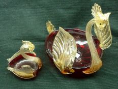 A large 20th Century Ruby and Clear Glass Model Swan; together with similar smaller example, the