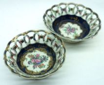 A set of three early 19th Century Worcester Pierced Baskets with floral decorated centres on a