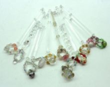 Approximately ten Clear Glass Lace Bobbins finished with glass bead spangles