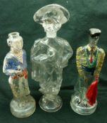 Three Continental Figural Glass Bottles, modelled as a Matador and two others with painted