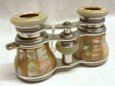 A pair of early 20th Century Metal and Mother of Pearl mounted Opera Glasses (lacking side