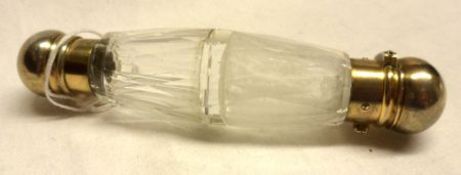 A late Victorian double clear glass Scent Bottle, (one end clouded within), partially gilded metal