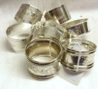 A group of Napkin Rings including a pair and three other Silver examples and three plated