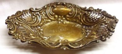 An Edward VII embossed large oval Bon Bon Dish with scrolled and pierced decoration, 7” x 4 ½”, (