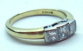 A hallmarked 18ct Gold Princess cut three Diamond Ring, line set, approximately.4ct total