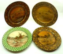 A group of four Doulton 10 ½” Plates, decorated with pastoral scenes, one with extensive damage