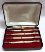 A cased set of four Bridge Pencils, with enamel Suits to the finials, stamped “Sterling”