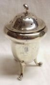 An Edwardian period three footed Pepper of acorn shape, the slightly domed lid with curved finial, 3
