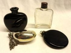 A group of four 20th Century Scent Bottles, two in black glass, one clear glass and one silver