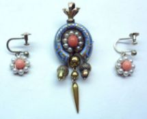 A Victorian Gold Pendant, horseshoe shaped with pale blue enamelled decoration and having a Coral