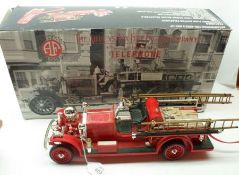 A Boxed Ahrens-Box Fire Engine Telephone, electronic push button telephone with normal ringer or