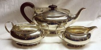 A George V three piece Tea Set of compressed oval form, with straight gadrooned rims, comprising: