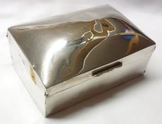 A rectangular Silver Encased Cigarette Box with domed lid, cedar-lined interior, 3 ½” x 5”, London
