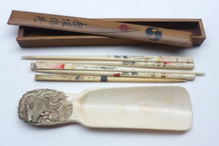 A 20th Century Cased Set of Oriental Chopsticks and a further Bone or Ivory Shoehorn, the handle