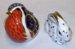 A Royal Crown Derby Paperweight modelled as a rabbit and a further example modelled as a crouching