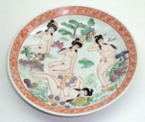A 20th Century Oriental Circular Plate, decorated in colours with nudes and foliage within an iron