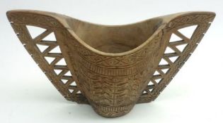 A two-handled Treen Basket or Stand, carved with tree and geometric motifs, 9” wide