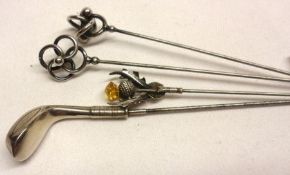 A group of four assorted white metal Finial Steel Hat Pins, one by Charles Horner and another with