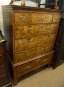 An 18th Century and later Walnut Chest, the upper section with two short drawers, flanking a central