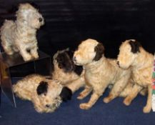 Three mid-20th Century Mohair Standing Terrier Dogs in A/F and playworn condition; together with two